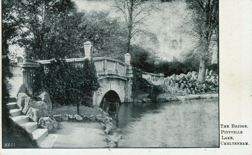 A view showing the bridge over Pittville Lake.