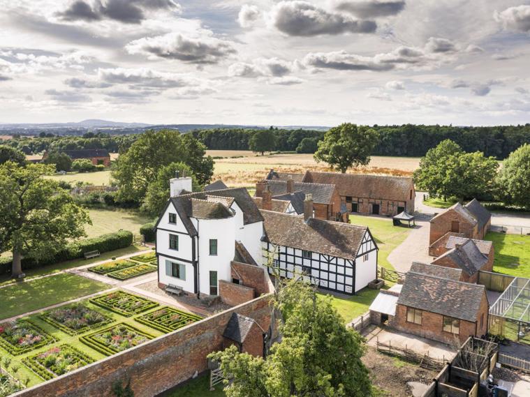 /localAn aerial view of a house and gardens